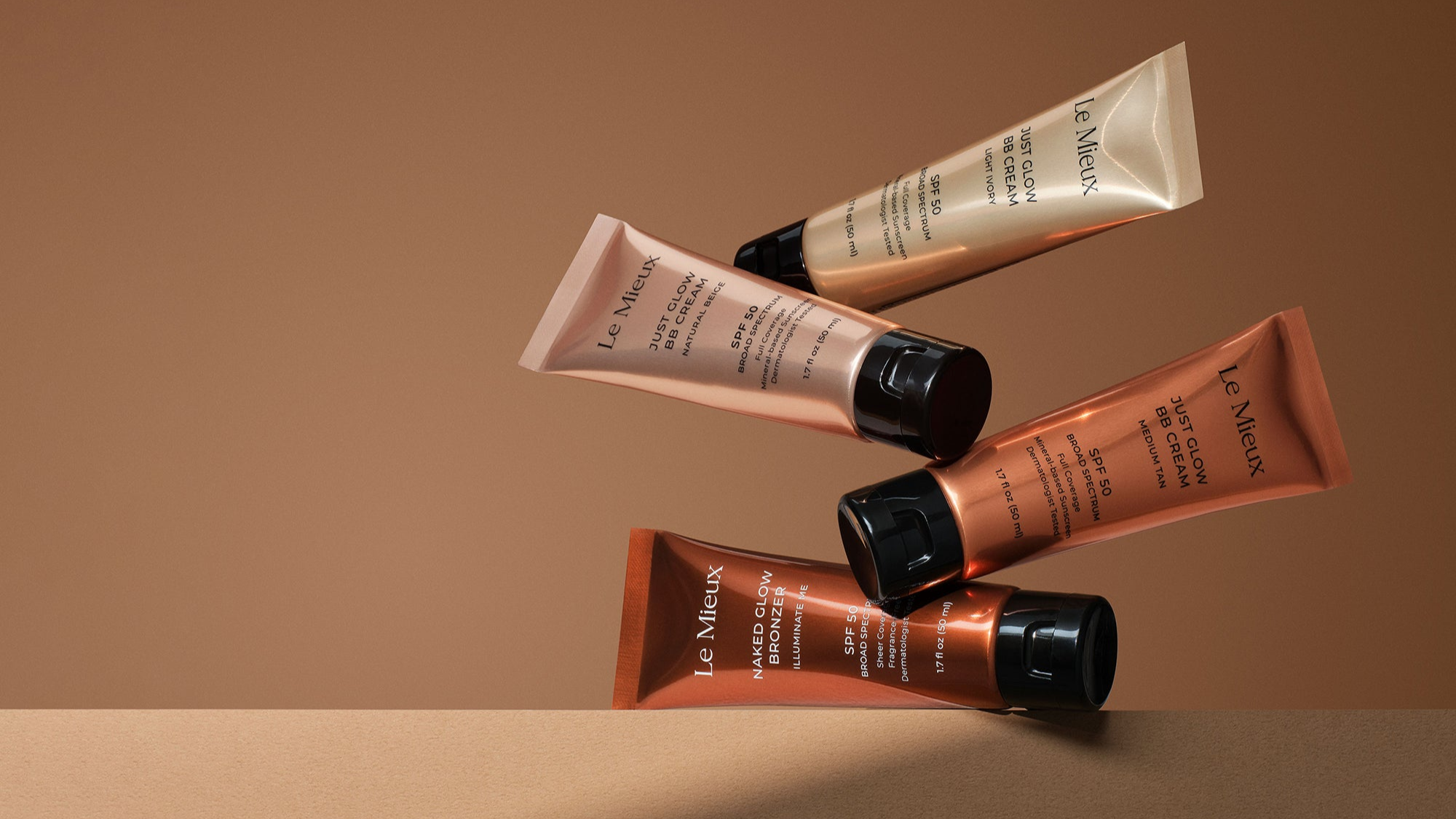 Le Mieux's SPF collection stacked on brown background