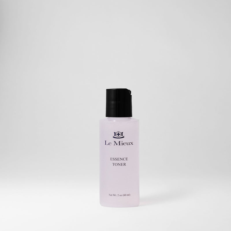 2 oz bottle of light pink Essence Toner with black lid isolated on light gray background