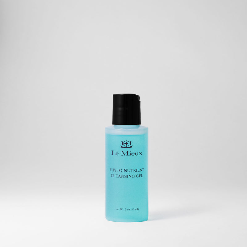 2 oz bottle of blue Phyto-Nutrient Cleansing Gel with black lid isolated on light gray background